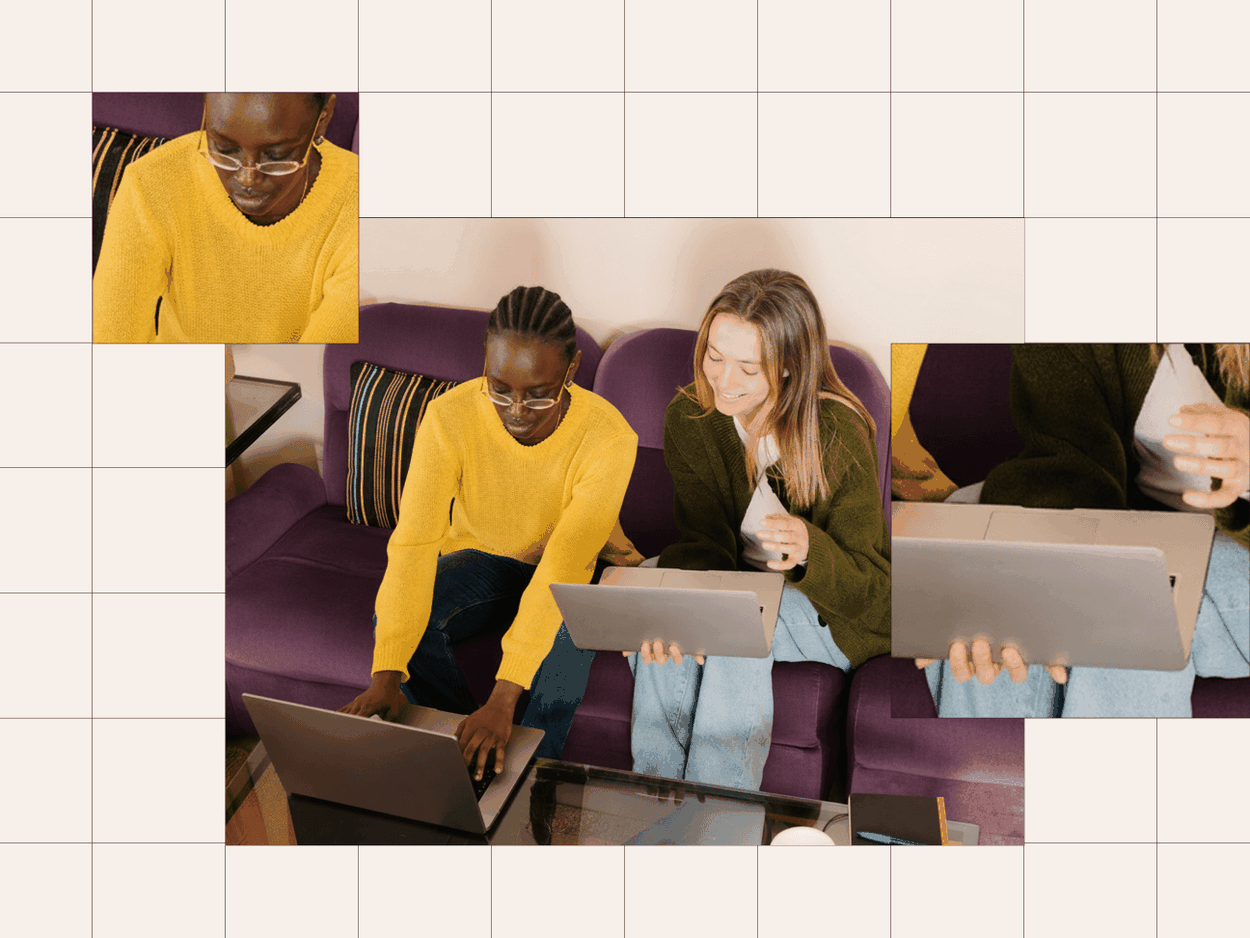 Woman in yellow sweater working on laptop with coworker